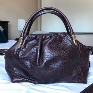 NINA RICCI - Burgundy leather bag.